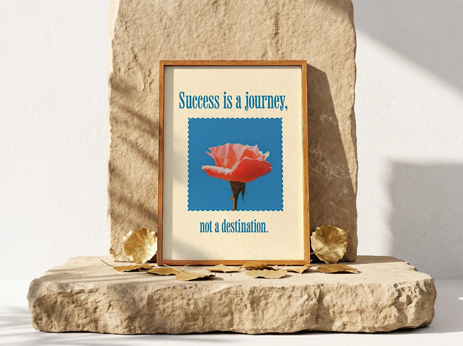 Affiche Essences Agape "Success is a Journey" avec une rose corail sur fond bleu, art de la réussite.