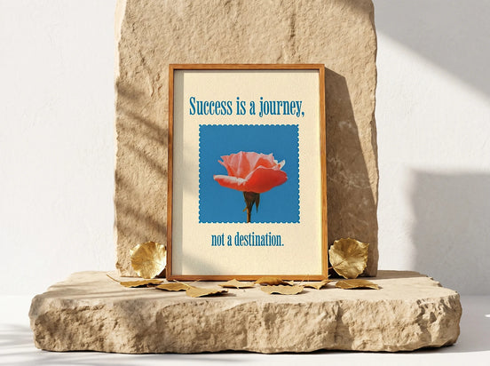 Affiche Essences Agape "Success is a Journey" avec une rose corail sur fond bleu, art de la réussite.