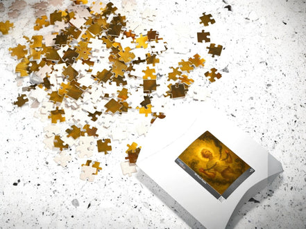 Essences Agape puzzle 500 pièces, peinture ésotérique d'une figure se libérant de chaînes dans une lumière dorée, symbolisant la renaissance et la force intérieure.